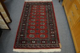 A Bokhara style rug 160cm x 96cm.