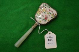 Decorative miniature Chinese hand mirror.