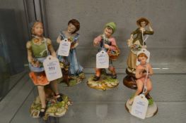 A group of five small capodimonte figures.