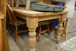 A pine kitchen table.