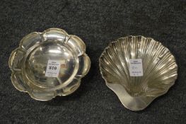 A lobed silver bowl and a shell shaped silver dish.