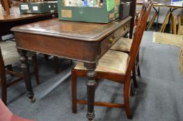A Victorian mahogany two drawer writing table.