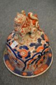 A large Imari vase cover.