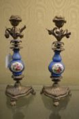 A pair of ormolu and porcelain candlesticks.