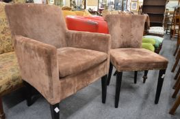 A modern upholstered small armchair and similar button back chair.