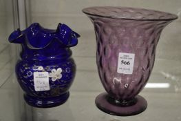 A Richardson amethyst tinted glass vase together with a blue glass vase enamel decorated with