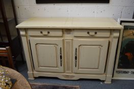 A cream painted dresser base.
