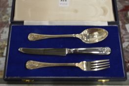A cased silver christening set.