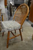 A set of four pine kitchen chairs.