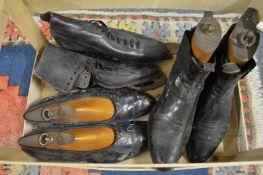 Three pairs of boots/shoes.