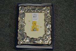 A children's silver photograph frame, boxed.