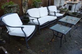 A five piece cast aluminium garden lounge set comprising two seater settee, pair of armchairs,