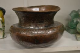 An Indian tinned copper spittoon with engraved decoration.