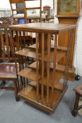 An oak revolving bookcase.
