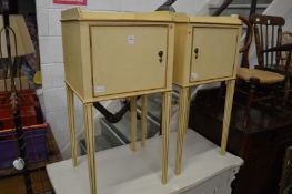 A pair of cream painted bedside cupboards.