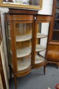An Edwardian inlaid mahogany two door display cabinet.