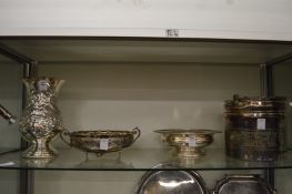 A large embossed white metal vase, two dishes and an ice bucket.