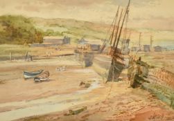 J. W. Williams (19th/20th Century), Boats moored in a harbour at low tide, watercolour, signed, 6.5