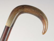 AN ANTIQUE BOVINE HORN HANDLE WALKING STICK, 86cm long.