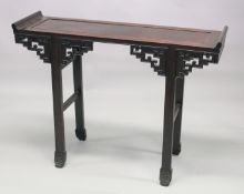 A CHINESE ROSEWOOD ALTER TABLE, the panelled rectangular top with curving ends, on stretchered