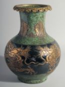 A CHINESE GILT AND SPECKLED GREEN GLAZE FRENCH STYLE VASE, the rim with metal mount, body