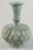 A MUGHAL INDIAN BRASS BOTTLE VASE, 16.5cm high.