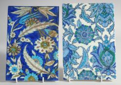TWO IZNIK STYLE GLAZED POTTERY TILES, each 23.5cm x 16cm.