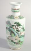 A CHINESE FAMILLE VERTE PORCELAIN VASE, painted with a figure stood within a vast landscape scene,