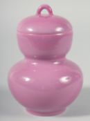 A CHINESE PINK GLAZE PORCELAIN DOUBLE GOURD LIDDED POT, character mark to base, 14cm high.
