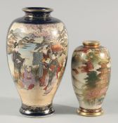 TWO JAPANESE SATSUMA VASES, the larger painted with panels of figures in a landscape, each with