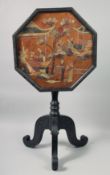 A CHINESE CARVED HARDWOOD TILT TOP TABLE, the octagonal table top inlaid with carved hardstone