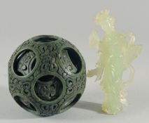 A LARGE CHINESE CARVED HARDSTONE PUZZLE BALL, 12cm high, together with a carved jade figure of a