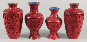 A PAIR OF CHINESE CINNABAR LACQUER VASES, decorated with landscape scenes, together with two similar