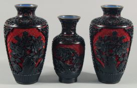 A PAIR OF CHINESE BLACK CINNABAR LACQUER VASES, with floral decoration, together with a similar