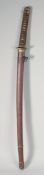 A JAPANESE WORLD WAR II OFFICER'S KATANA, with cord bound grip, cast bronze tsuba, in a red
