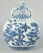 A CHINESE BLUE AND WHITE PORCELAIN TWIN HANDLE MOON FLASK, decorated with native flora, bearing