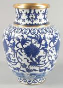 A CHINESE BLUE AND WHITE CLOISONNE VASE, decorated with stylised flower heads and curling vines,