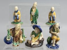 A COLLECTION OF SIX SMALL CHINESE SANCAI GLAZED POTTERY FIGURES, tallest 8cm high.