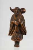 A JAPANESE CARVED WOODEN NETSUKE of a traveller carrying a gourd shape bottle over his shoulder, 5.