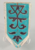 A RARE 14TH CENTURY PERSIAN OR CENTRAL ASIAN TIMURID GLAZED POTTERY MUKARNAS TILE, with turquoise