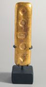 A CHINESE STAMPED INGOT, on stand.