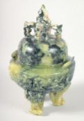 A CHINESE MARBLED GREEN SOAPSTONE TRIPOD LIDDED CENSER, 17cm high.