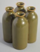 AN UNUSUAL CHINESE TEA DUST GLAZE FOUR-BOTTLE VASE, with characters to the base, 9cm high.