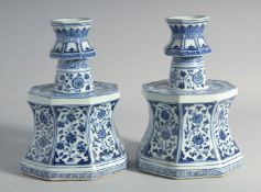 A LARGE PAIR OF CHINESE BLUE AND WHITE PORCELAIN CANDLESTICKS, decorated with panels of flora,