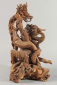 A GOOD QUALITY LARGE THAI CARVED WOOD FIGURAL GROUP, 48cm high.