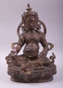 A TIBETAN BRONZE BUDDHA, with traces of red paint and gilt decoration, 30cm high.