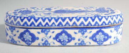 A TURKISH BLUE AND WHITE GLAZED POTTERY PEN BOX, 30cm long.