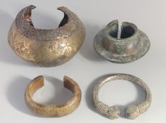A LOT OF FOUR METAL ITEMS, including two bangles, (4).