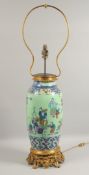 A VERY LARGE CHINESE GREEN GROUND FAMILLE ROSE PORCELAIN VASE / LAMP with ormolu mounted base,