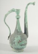 AN EARLY EASTERN METAL EWER, 34cm high.